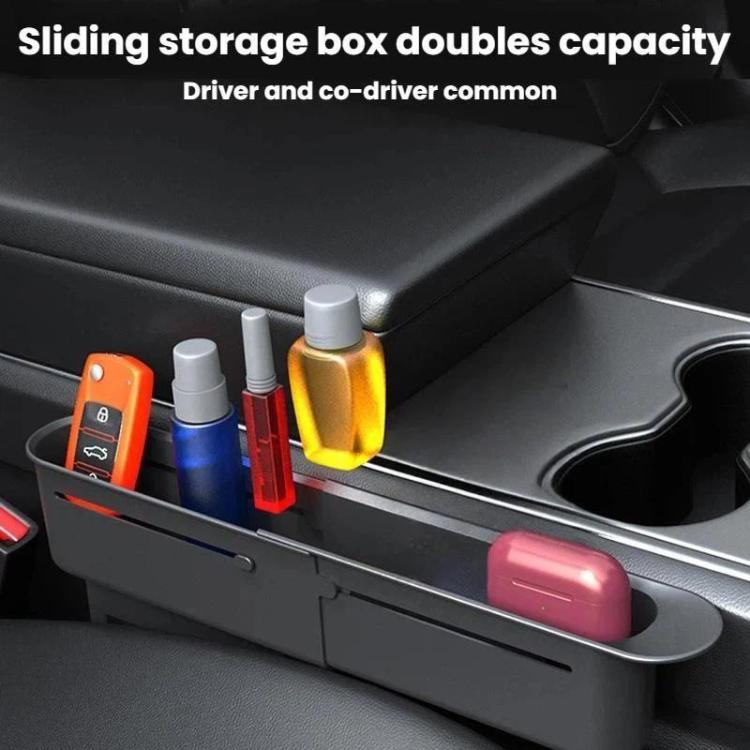 Black in-car retractable storage box mounted between seats with open side compartments