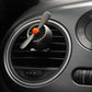 Car air vent air freshener ornament clipped in a round vent with orange top
