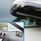 Rear trunk-mounted camera lens under taillight with black protective housing
