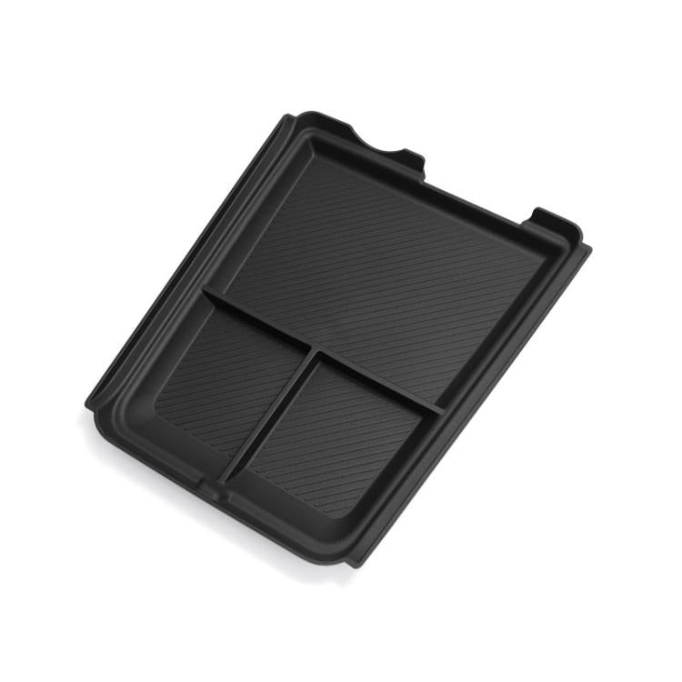Black center console lower storage box with divided compartments and molded tray.