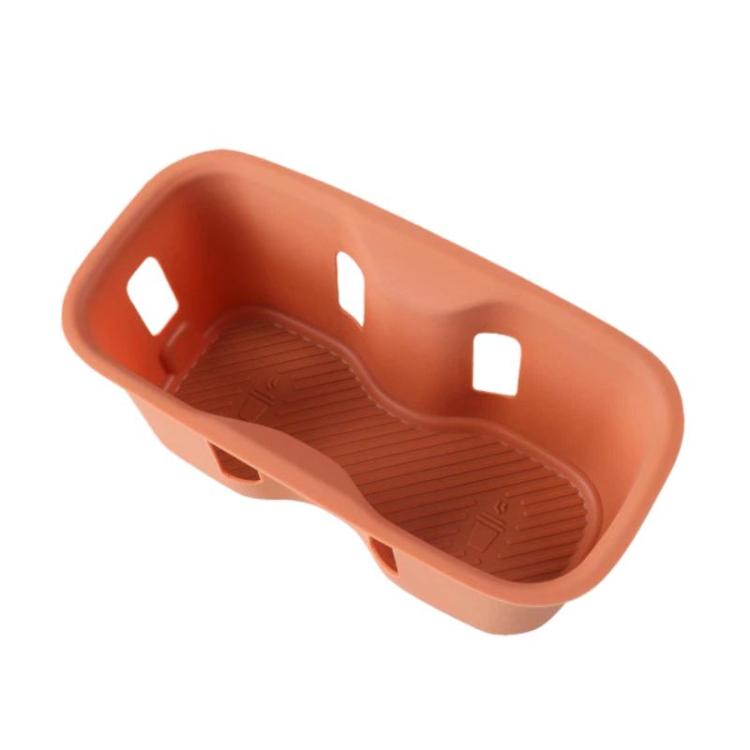 Orange silicone water bottle pad insert with raised grip pattern and side slots