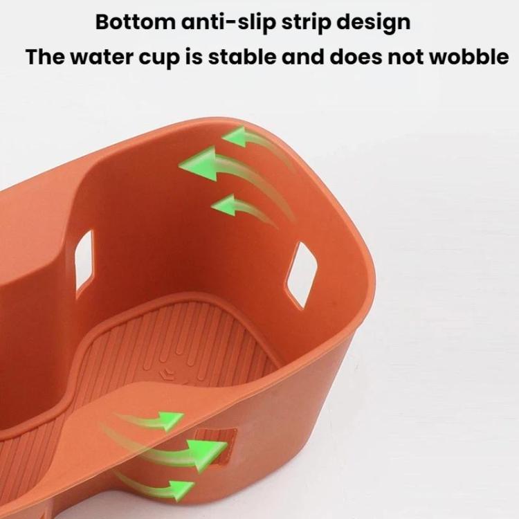Orange silicone water bottle pad insert with textured base and anti-slip bottom strip