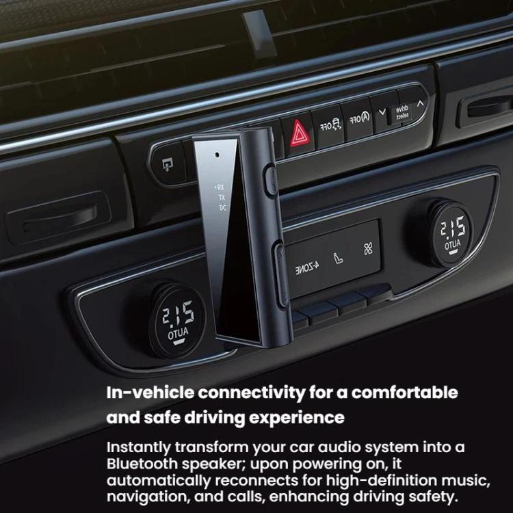 Car AUX Bluetooth adapter plugged into dashboard AUX port, black with display