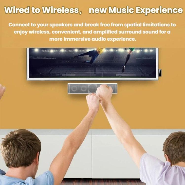 Black Bluetooth audio adapter plugged into a TV soundbar on a desk