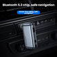 Black Bluetooth audio adapter clipped near car dashboard controls