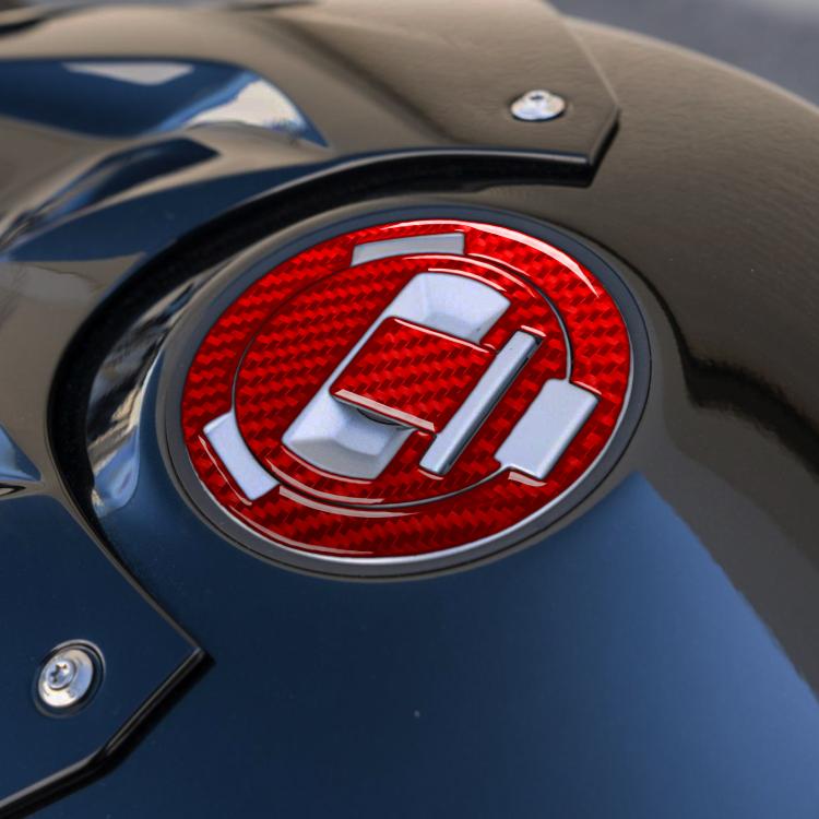 Round fuel tank cap sticker with red carbon-fiber pattern, chrome ring and silver inserts