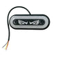 White/clear waterproof LED strobe light with black bezel, two screws, and wired power leads