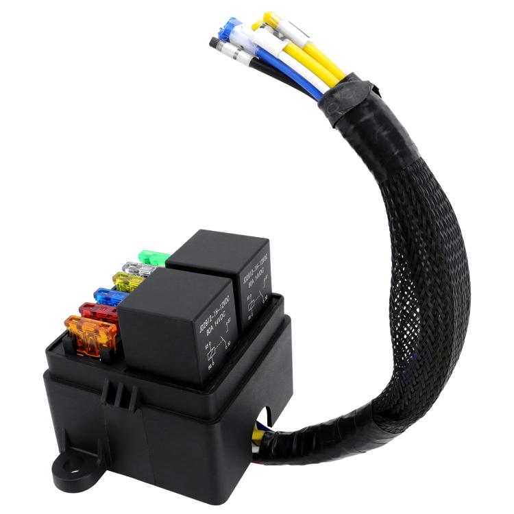 Black fuse box with relay and multi-wire harness, blade fuses visible