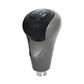 Manual gear shift knob with black top and silver base, H and gear markings