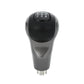 Manual gear shift knob with black top and silver base, H and gear letters