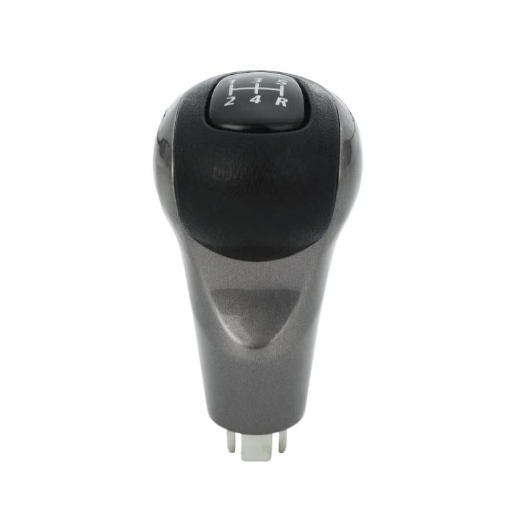Manual gear shift knob with black top and silver base, H and gear letters