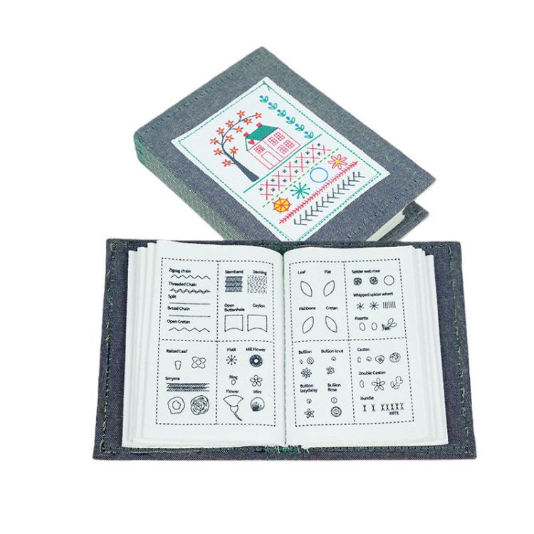 DIY embroidery stitch book with 10-page guide, open to colorful stitch charts