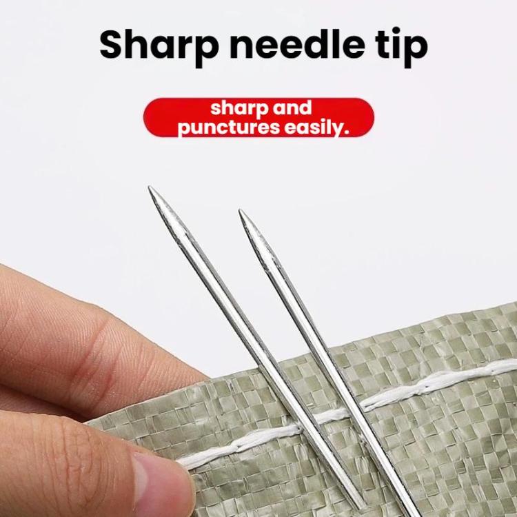 Sharp sewing needle tips near fabric, with two needles and large eyes