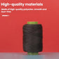 Black sewing thread spool on green core, close-up