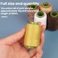 Yellow sewing thread spool held in hand with several spools behind