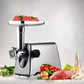 Electric meat grinder on a countertop with stainless steel body and feed tube