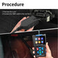 Hand plugging OBD2 cable into car DLC while holding black diagnostic scanner