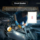 Automotive circuit diagnostic tester placed in engine bay with probe leads connected
