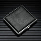 Black textured leather cigarette case with metal edges, hinged lid closed.