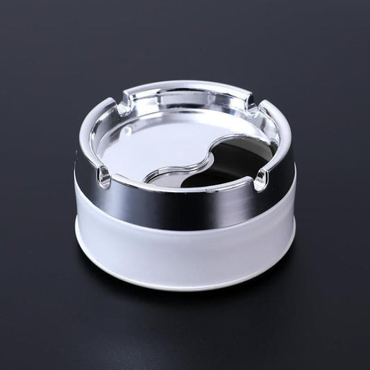 White desktop rotating ashtray with chrome lid and inner smoking rest