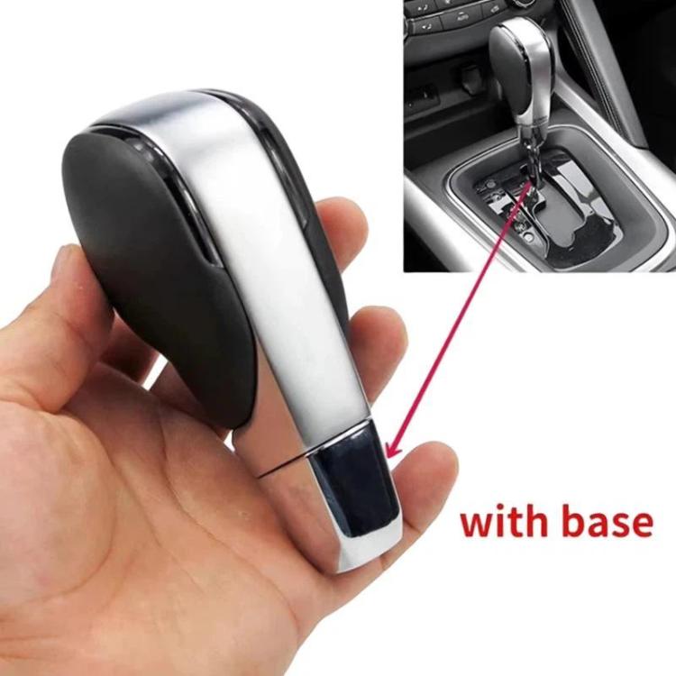 Car shift knob with black handle and silver sides, shown with installation base