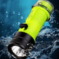 Waterproof diving flashlight with bright green body and wet, shining front lens