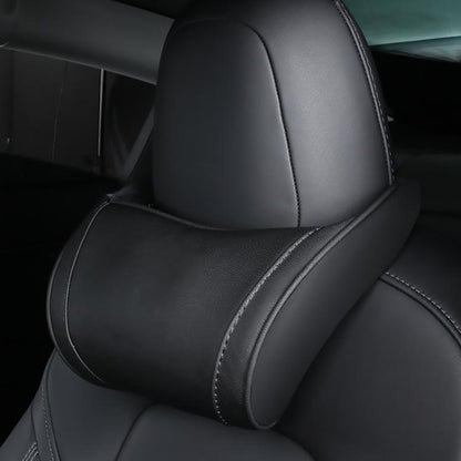 Leather seat neck pillow in black with curved bolster and stitched trim on headrest