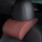 Coffee brown leather seat neck pillow with tan edge stitching on car headrest