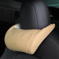 Beige leather seat neck pillow with light edge stitching on car headrest