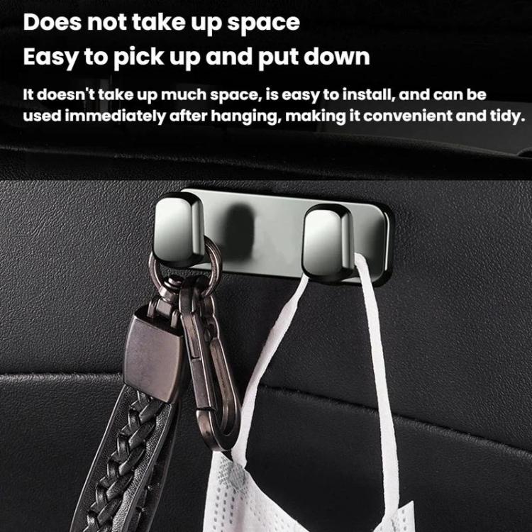 Light silver adhesive hooks holding keychains and lanyards on car seat