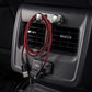 Light silver adhesive hooks installed near car air vent, holding lanyard cable