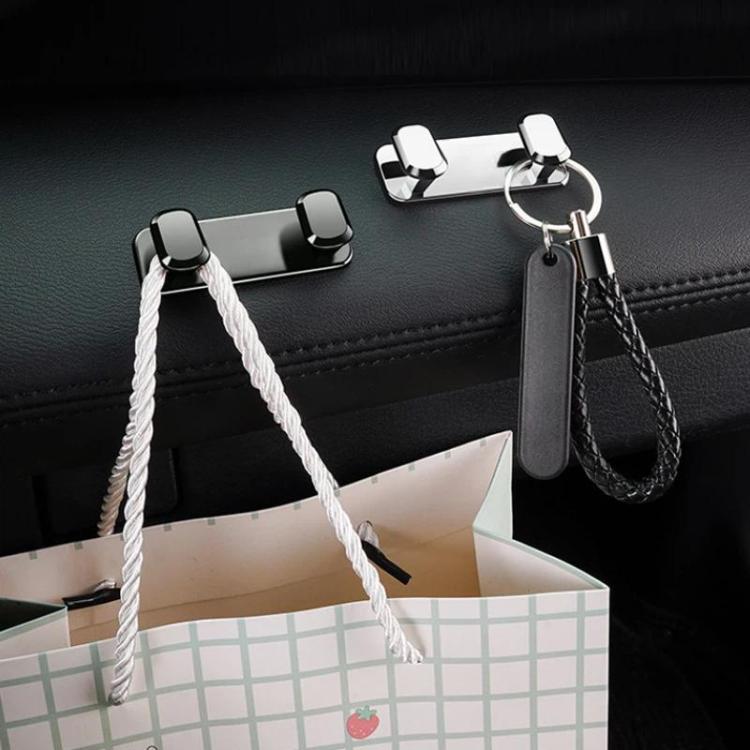 Car seat adhesive hook set with light silver hooks holding bags and keys