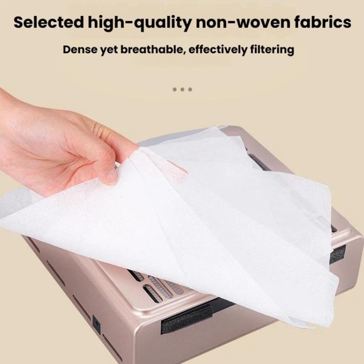 White non-woven filter pad being fitted over nail dust vacuum inlet