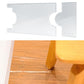 Clear acrylic sofa leg protector pads installed under wooden furniture legs
