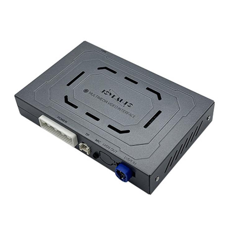 Wireless car media module, gray box with ports and label on top panel.