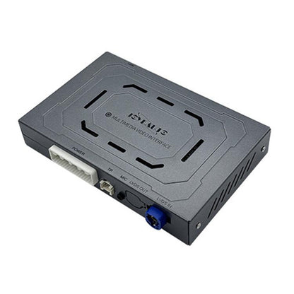 Wireless car media module, gray box with ports and label on top panel.