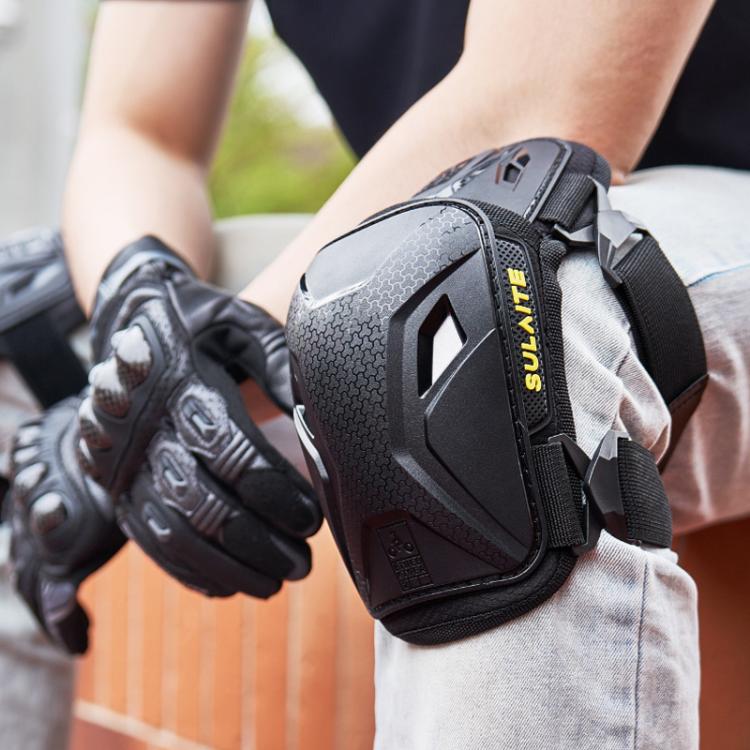 Motorcycle knee pad on leg with black-and-gray armored shell and elastic strap