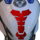 Motorcycle fuel tank sticker, red carbon-fiber emblem centered on fuel tank