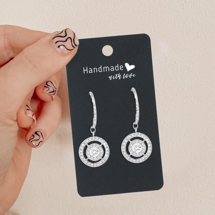 Black earring display card label with top hole and two hanging hoop earrings