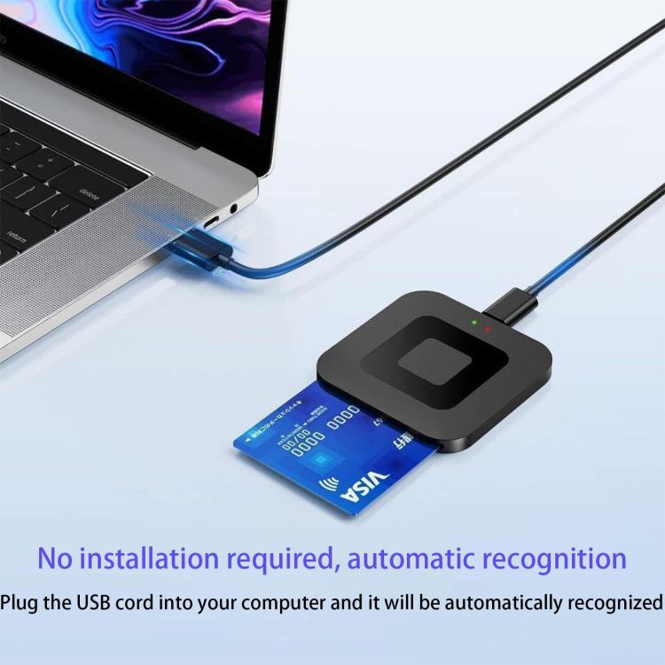 Black card reader connected to a laptop USB port with blue bank card