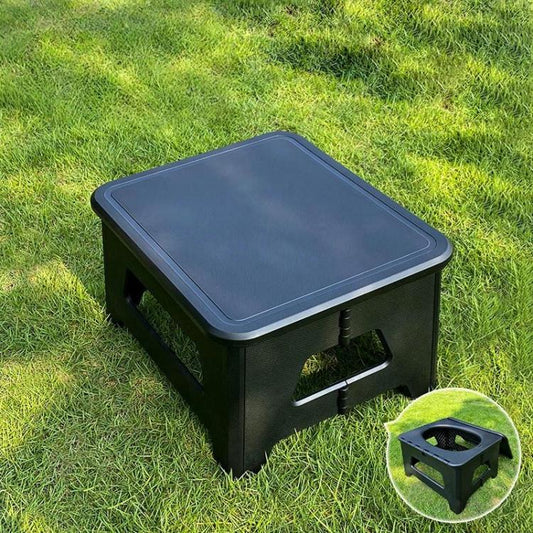 Large black portable camping toilet stool with closed square lid and side cutouts