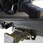 Installed square-head trailer hitch lock with black head and chrome shank
