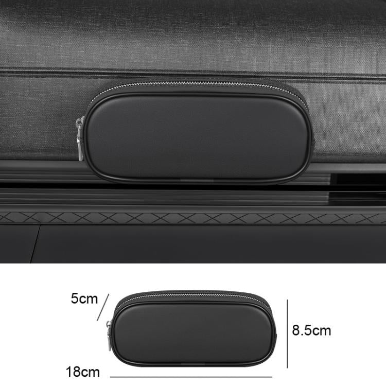 Black oval zippered eyeglasses and coin storage case mounted on car interior