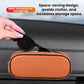 Orange oval eyeglasses and coin storage case attached to car dashboard