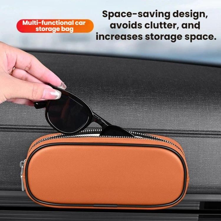 Orange oval eyeglasses and coin storage case attached to car dashboard