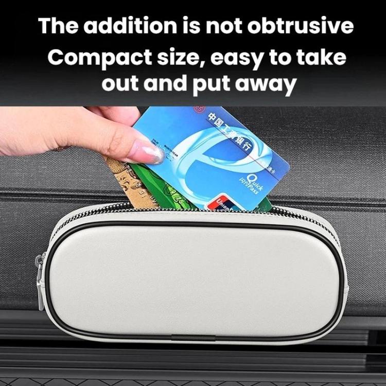 Light beige oval zippered storage case with cards inside, mounted on car door