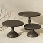Black tiered cake stand set with three round plates on pedestal bases