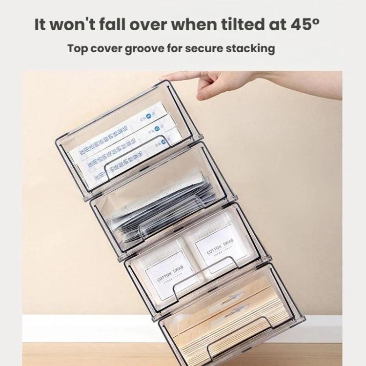 Clear drawer organizer tipped open at an angle with interior trays and dividers