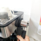 Handle storage rack attached beside espresso machine portafilter area