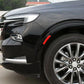 Red reflective fender warning decal strip on a car front wheel arch